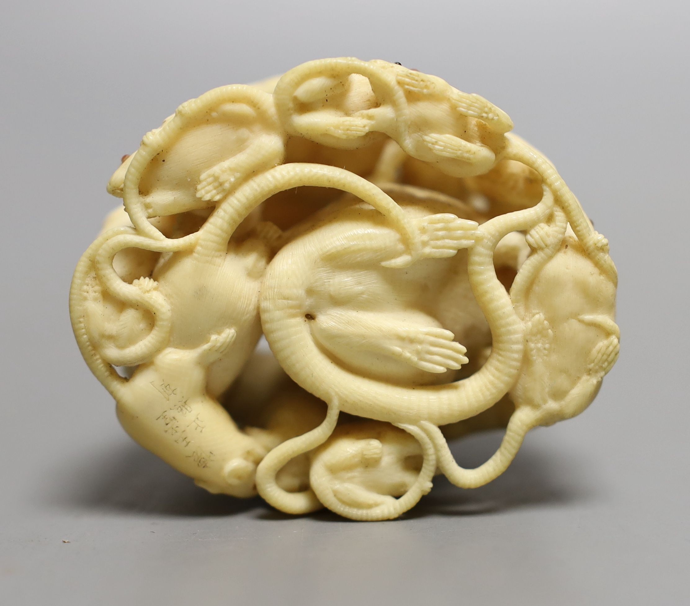 A fine Japanese carved ivory Okimono of a “mischief “ of rats, Meiji period, six character inscription, 5cms high.